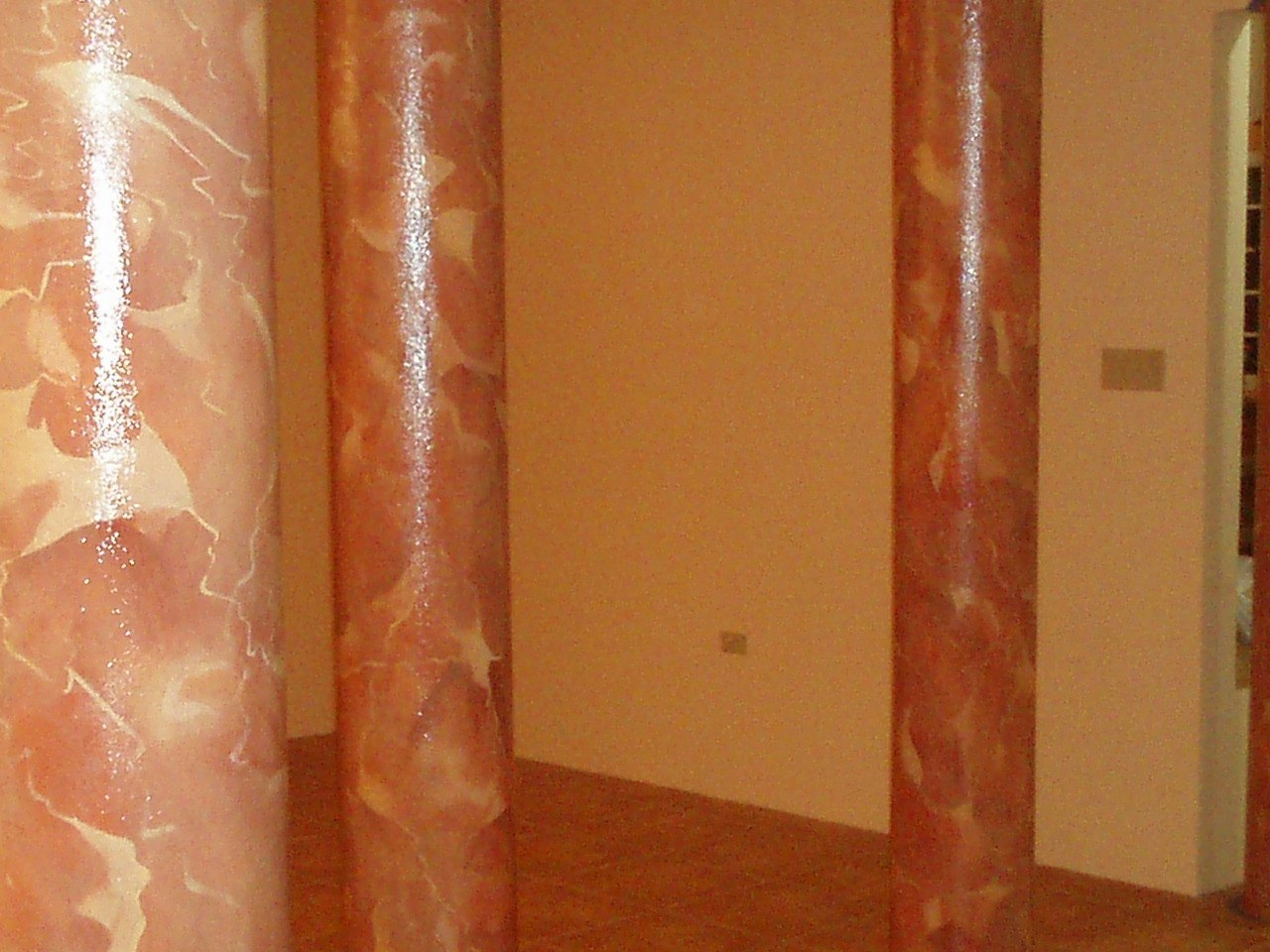 Veining and light across two finished column faces.