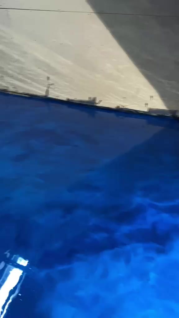 Deep blue metallic epoxy with hand-worked movement across the completed JBDC floor.