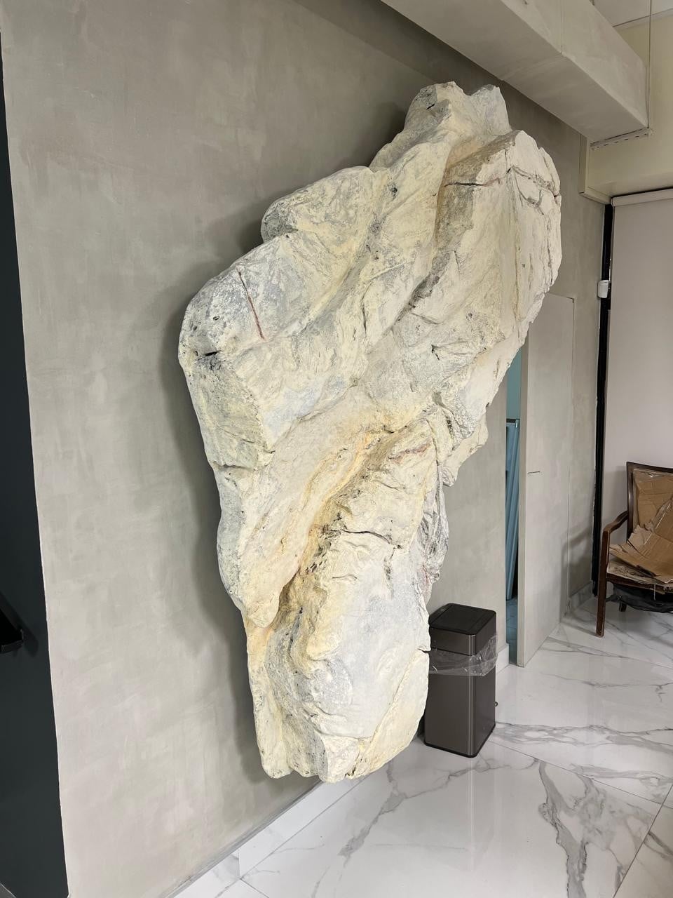 Completed stonewashed wall sculpture with backlighting